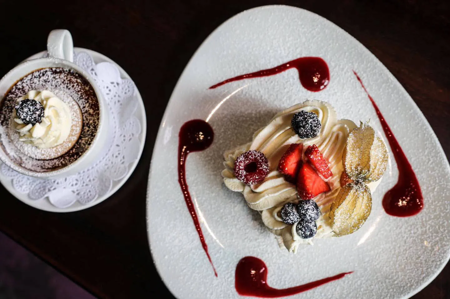 Dessert with fresh berries and a raspberry coulis