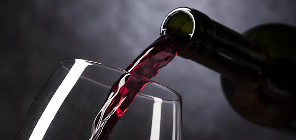 Red wine being poured into a glass
